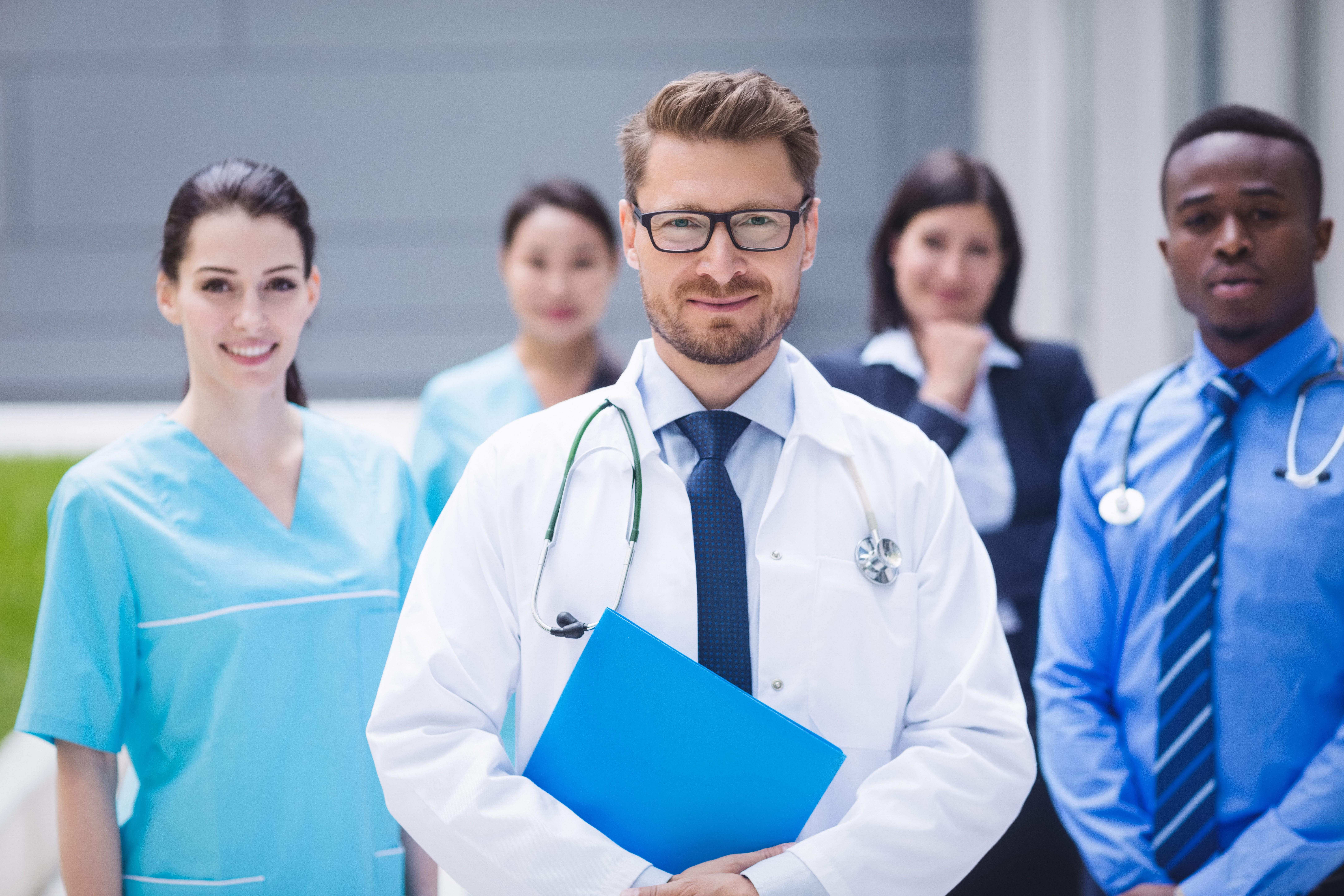 Motifworks-Team of doctors standing together hospital premises