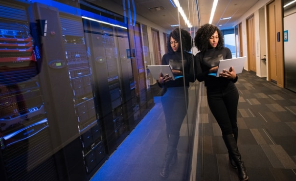 Women holding tab to use Azure financial services